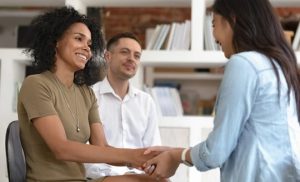 Young couple with financial advisor