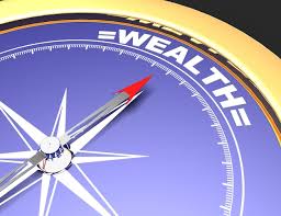 compass with a blue background and gold edge with arrow pointing to wealth