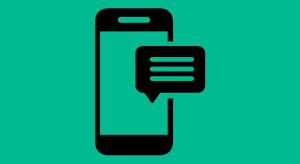 moblie phone with text bubble on a green background